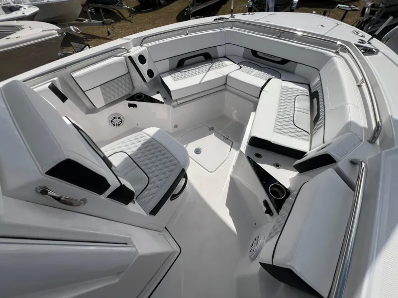 Slide: The Image of 2025 Blackfin 252 CC boat interior with luxurious white seating and modern design. - 20