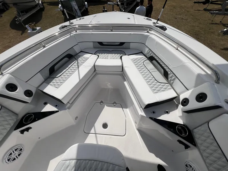 Slide: The Image of 2025 Blackfin 252 CC boat interior with white cushioned seating and modern design. - 21