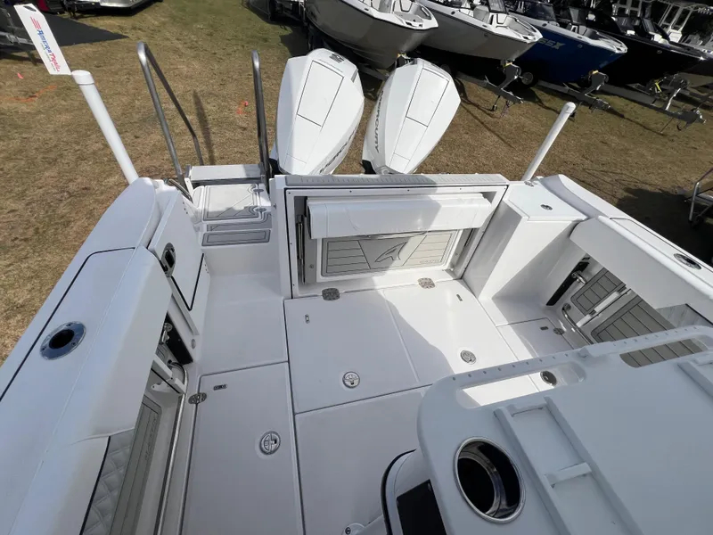 Slide: The Image of 2025 Blackfin 252 CC boat deck with dual engines, spacious layout, and modern design. - 9