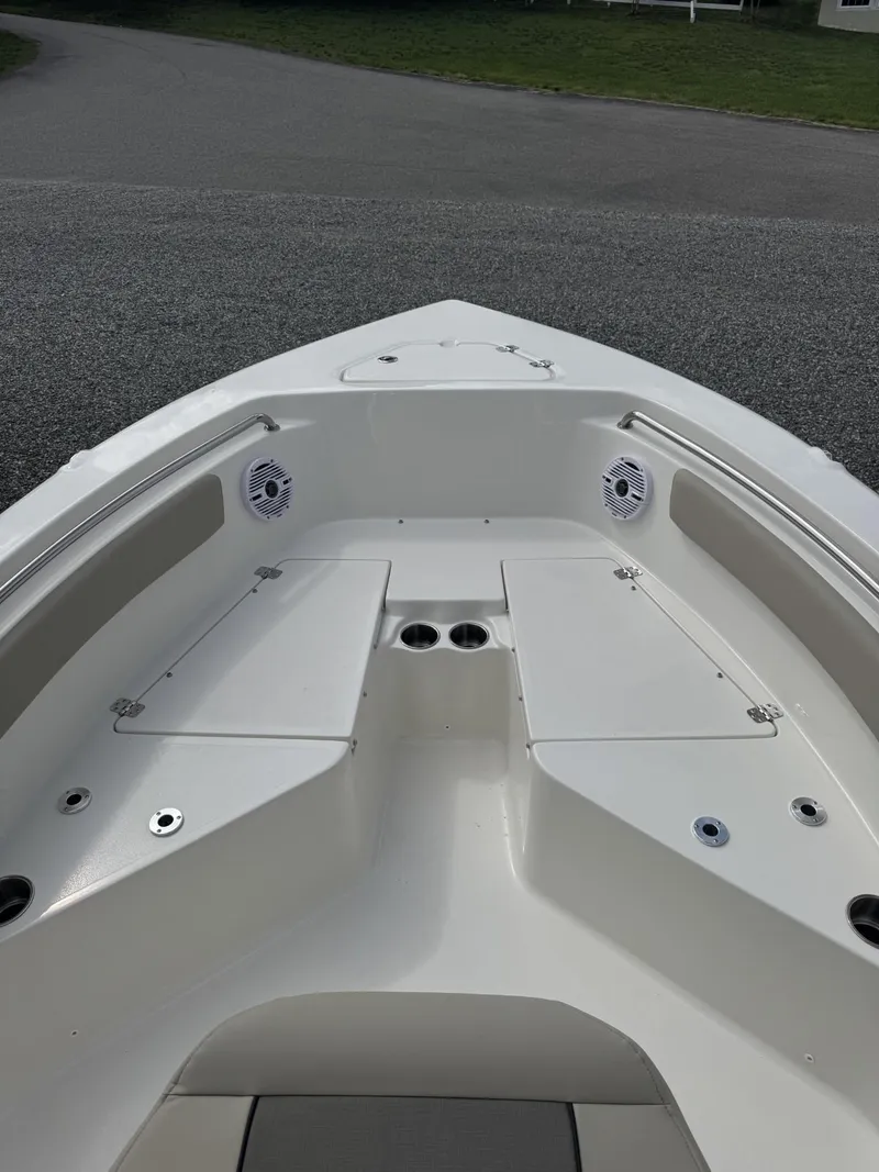 Slide: The Image of 2025 Key West 203 FS boat bow with seating and storage compartments. - 3