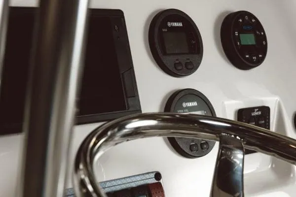 Slide: The Image of Control panel of 2025 Key West 203 FS boat with Yamaha gauges and steering wheel. - 8