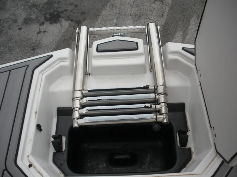Slide: The Image of 2024 Starcraft SVX 190 OB DC boat ladder and storage compartment. - 11