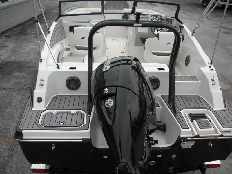 Slide: The Image of 2024 Starcraft SVX 190 OB DC boat with outboard motor, spacious seating, and modern design. - 13