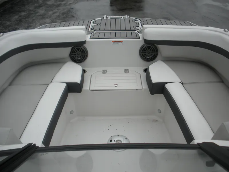 Slide: The Image of 2024 Starcraft SVX 190 OB DC boat interior with cushioned seating and speakers. - 3