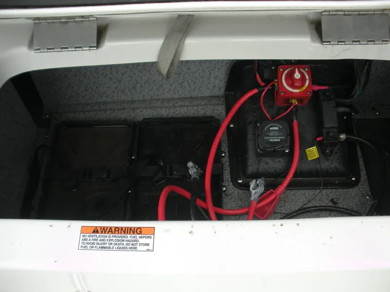 Slide: The Image of 2024 Starcraft SVX 190 OB DC battery compartment with wiring and safety warning label. - 8