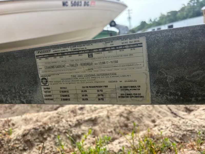 Slide: The Image of 2016 Alumacraft 2072 Bay boat trailer label with specifications and details. - 15