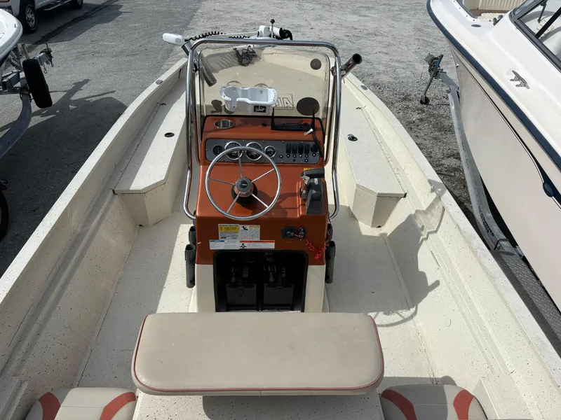 Slide: The Image of 2016 Alumacraft 2072 Bay boat interior with steering console and seating. - 4