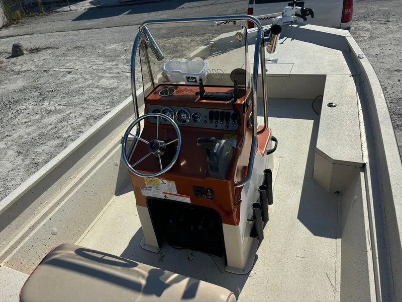 Slide: The Image of 2016 Alumacraft 2072 Bay boat interior with steering console and seating. - 5