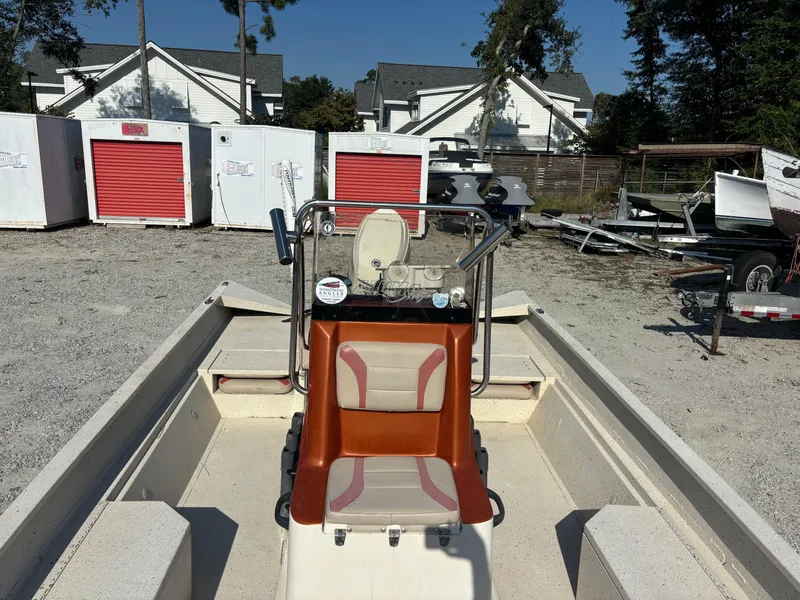 Slide: The Image of 2016 Alumacraft 2072 Bay boat with central console, parked outdoors. - 9
