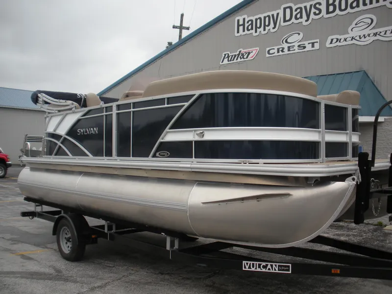 Slide: The Image of 2024 Sylvan Mirage 820 LZ pontoon boat on trailer at dealership. - 1
