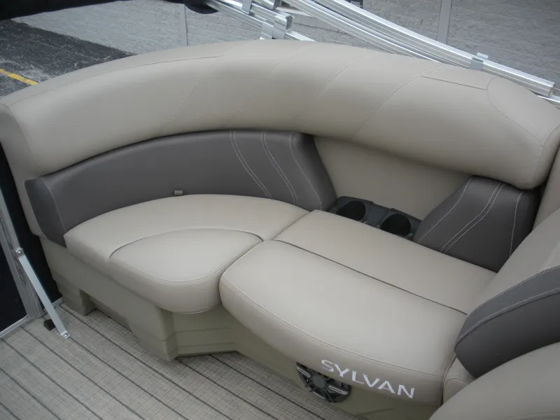 Slide: The Image of 2024 Sylvan Mirage 820 LZ boat seating with beige and gray upholstery. - 7