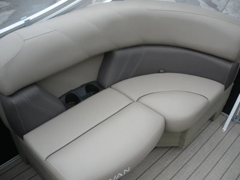 Slide: The Image of 2024 Sylvan Mirage 820 LZ boat seating with beige upholstery and cup holders. - 8
