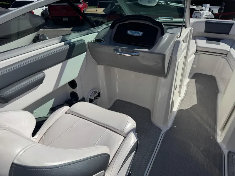 Slide: The Image of 2020 Chaparral 21 SSi Ski & Fish OB interior with seating and dashboard. - 11
