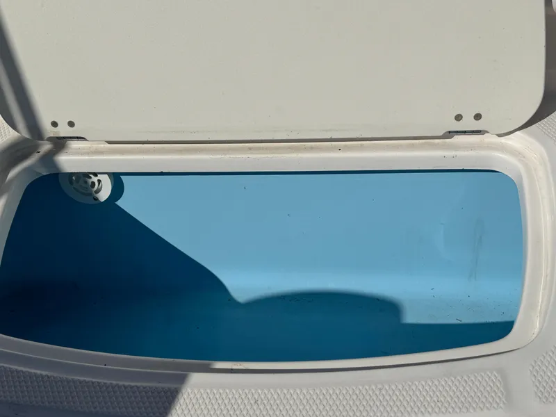 Slide: The Image of Open storage compartment in 2020 Chaparral 21 SSi Ski & Fish OB boat. - 15