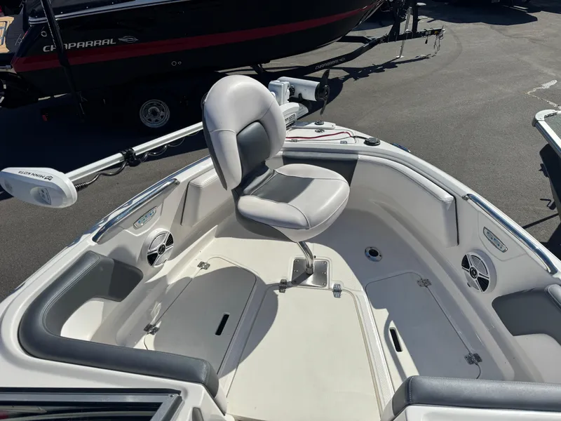 Slide: The Image of 2020 Chaparral 21 SSi Ski & Fish OB boat interior with seating and fishing setup. - 19