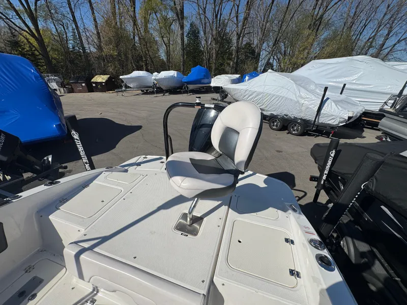 Slide: The Image of 2020 Chaparral 21 SSi Ski & Fish OB boat with swivel seat, parked outdoors. - 20