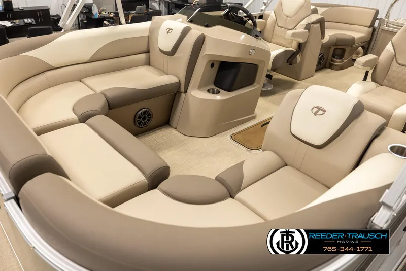 Slide: The Image of 2024 Tahoe 2185 LTZ QL boat interior with luxurious beige seating and modern design. - 10