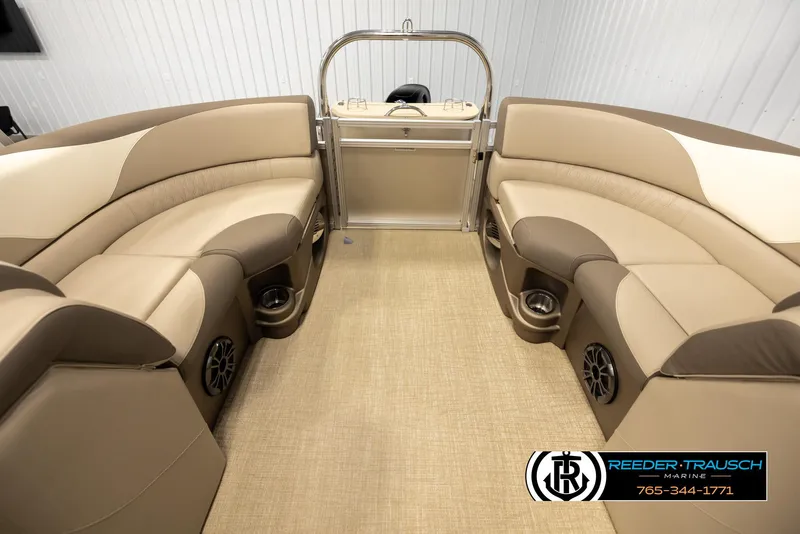 Slide: The Image of 2024 Tahoe 2185 LTZ QL pontoon boat interior with beige seating and cup holders. - 15