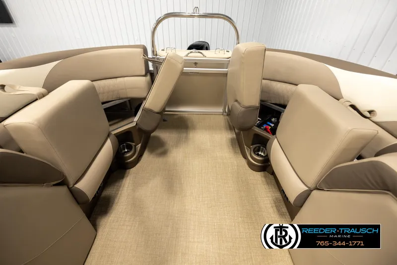 Slide: The Image of 2024 Tahoe 2185 LTZ QL boat interior with beige seating and carpet flooring. - 16