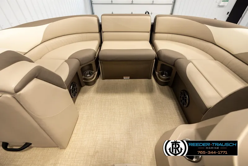 Slide: The Image of 2024 Tahoe 2185 LTZ QL boat interior with beige seating and cup holders. - 19