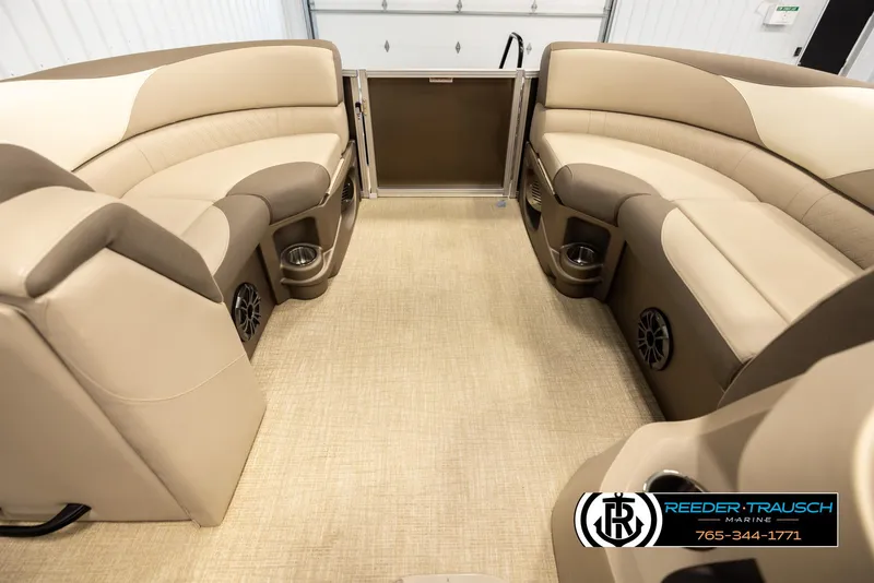 Slide: The Image of 2024 Tahoe 2185 LTZ QL boat interior with beige seating and cup holders. - 20