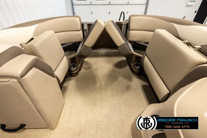 Slide: The Image of 2024 Tahoe 2185 LTZ QL boat interior with beige seating and cup holders. - 21