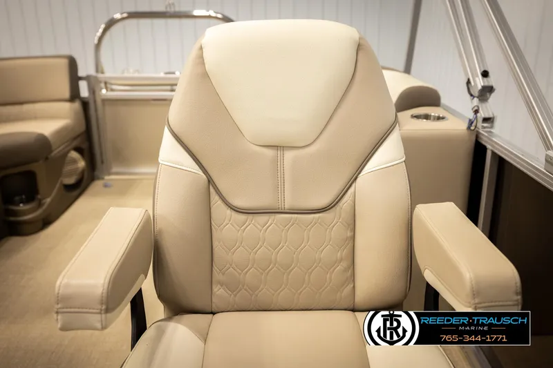 Slide: The Image of Luxurious seating on 2024 Tahoe 2185 LTZ QL boat, featuring beige upholstery and armrests. - 24
