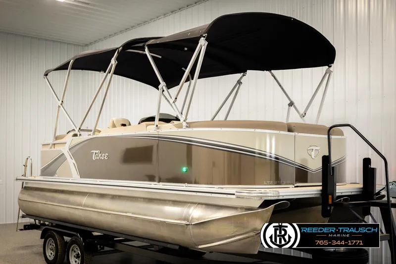 Slide: The Image of 2024 Tahoe 2185 LTZ QL pontoon boat on trailer in indoor showroom. - 3