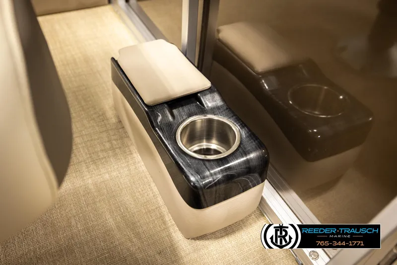 Slide: The Image of 2024 Tahoe 2185 LTZ QL boat cup holder with armrest, beige and black design. - 30