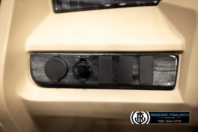 Slide: The Image of Control panel of 2024 Tahoe 2185 LTZ QL with power outlets and switches. - 36