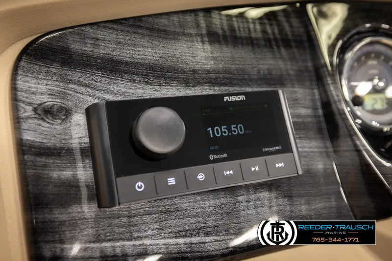 Slide: The Image of 2024 Tahoe 2185 LTZ QL dashboard with Fusion stereo system, displaying radio frequency 105.50. - 37