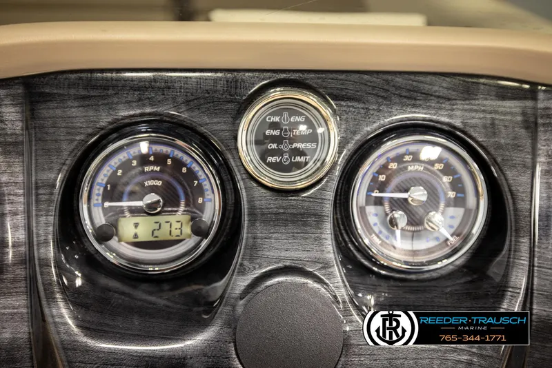 Slide: The Image of Dashboard of 2024 Tahoe 2185 LTZ QL with gauges and controls, featuring Reeder-Trausch Marine branding. - 38