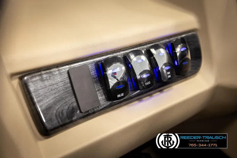 Slide: The Image of Control panel of 2024 Tahoe 2185 LTZ QL with labeled switches and blue lighting. - 41
