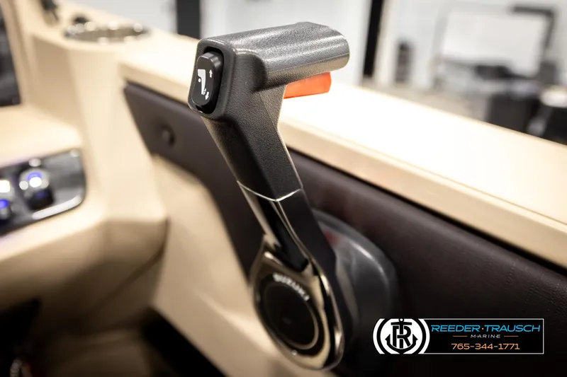 Slide: The Image of 2024 Tahoe 2185 LTZ QL throttle control lever in a boat interior. - 42