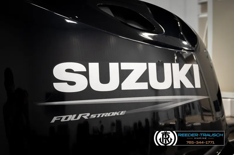 Slide: The Image of Suzuki Four Stroke engine on 2024 Tahoe 2185 LTZ QL boat, Reeder-Trausch Marine logo visible. - 45