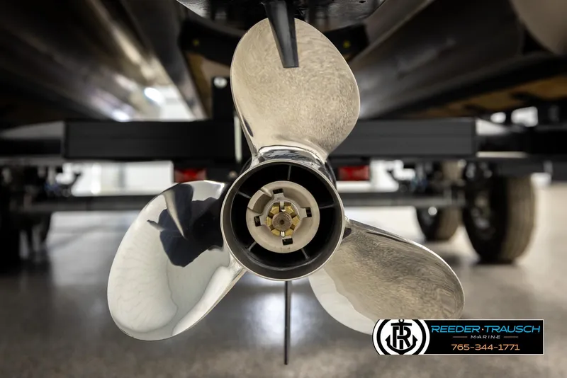 Slide: The Image of 2024 Tahoe 2185 LTZ QL boat propeller, close-up view in a showroom setting. - 47