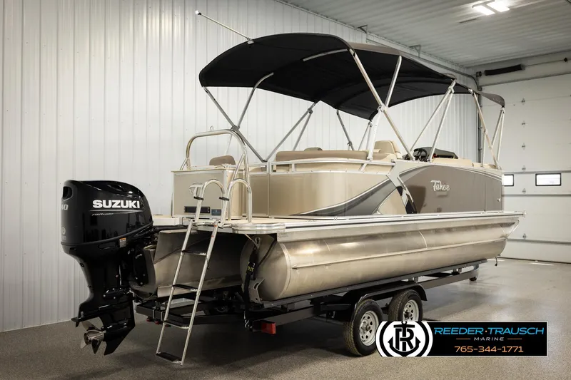 Slide: The Image of 2024 Tahoe 2185 LTZ QL pontoon boat with Suzuki outboard motor in a showroom. - 6