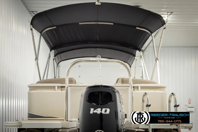 Slide: The Image of 2024 Tahoe 2185 LTZ QL pontoon boat with canopy and 140 HP engine in showroom. - 7