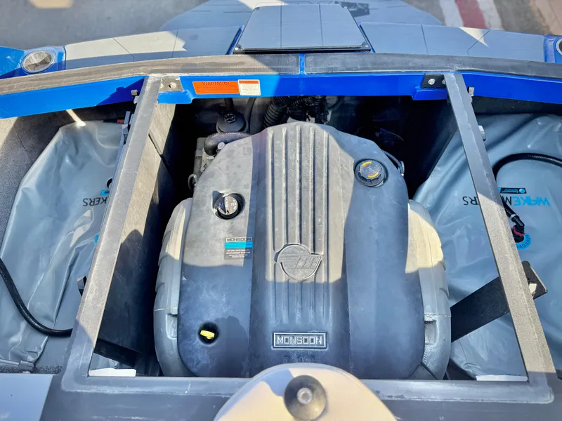 Slide: The Image of Engine compartment of a 2021 Axis T22 boat, featuring a Monsoon engine. - 25