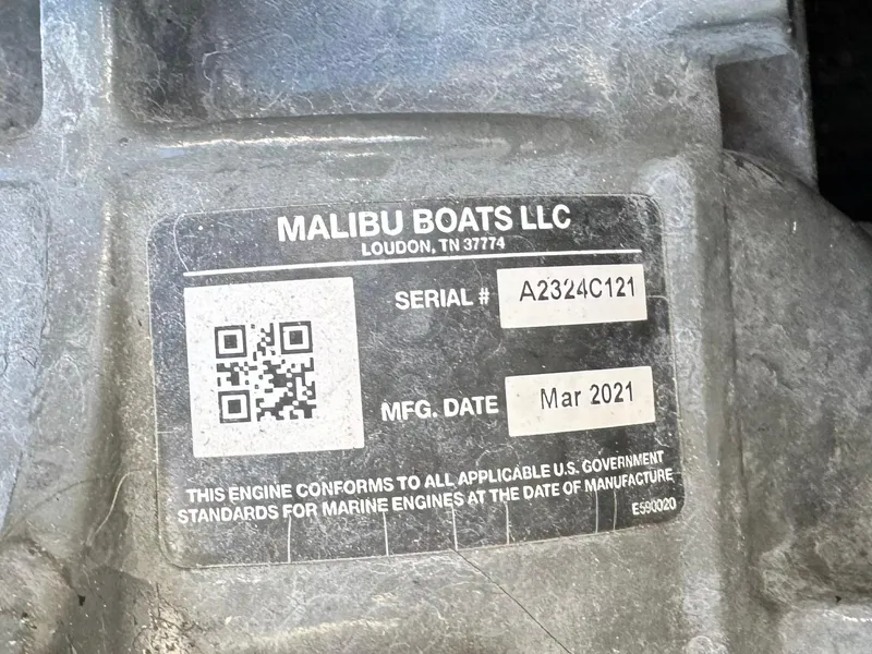 Slide: The Image of Label on Axis T22 boat engine, serial A2324C121, manufactured March 2021 by Malibu Boats LLC. - 26