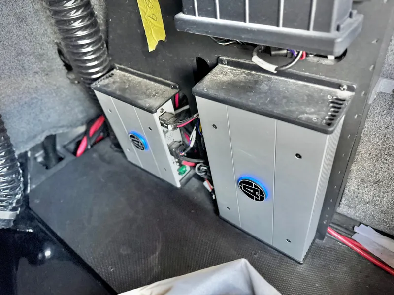 Slide: The Image of 2021 Axis T22 boat interior showing electronic components and wiring setup. - 27