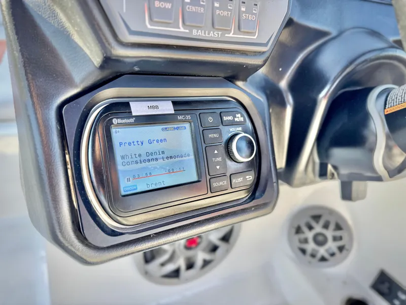 Slide: The Image of 2021 Axis T22 boat dashboard with audio system and control panel. - 32