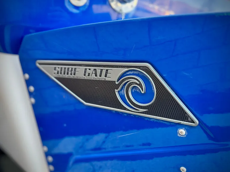 Slide: The Image of Close-up of 2021 Axis T22 Surf Gate logo on blue surface. - 6