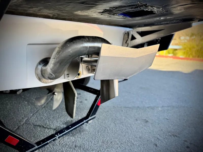 Slide: The Image of 2021 Axis T22 boat exhaust and propeller detail on trailer. - 7