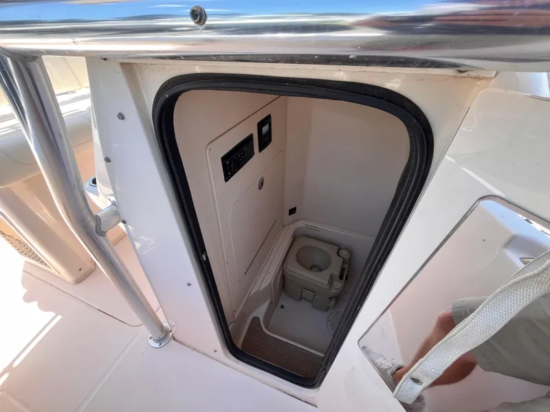 Slide: The Image of 2013 Grady-White Fisherman 257 boat interior with compact marine toilet. - 10