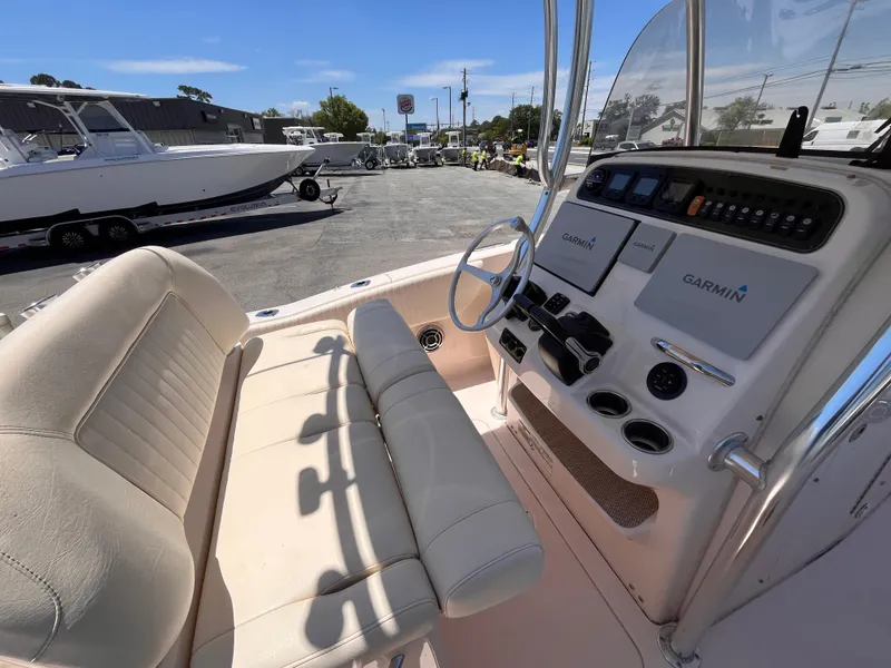Slide: The Image of 2013 Grady-White Fisherman 257 boat interior with Garmin navigation system and seating. - 11