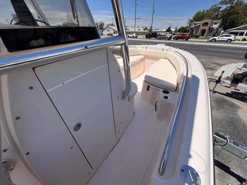 Slide: The Image of 2013 Grady-White Fisherman 257 boat interior with seating and console, parked on a trailer. - 14