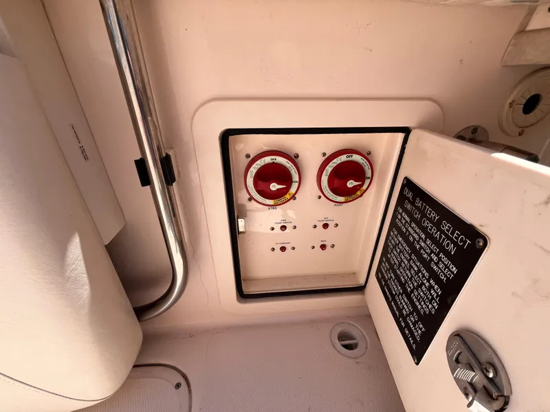 Slide: The Image of Control panel of a 2013 Grady-White Fisherman 257 boat with battery selectors. - 23