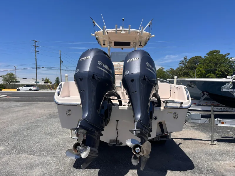 Slide: The Image of 2013 Grady-White Fisherman 257 boat with twin Yamaha engines, parked outdoors. - 3