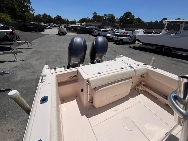 Slide: The Image of 2013 Grady-White Fisherman 257 boat with dual engines in a marina setting. - 5